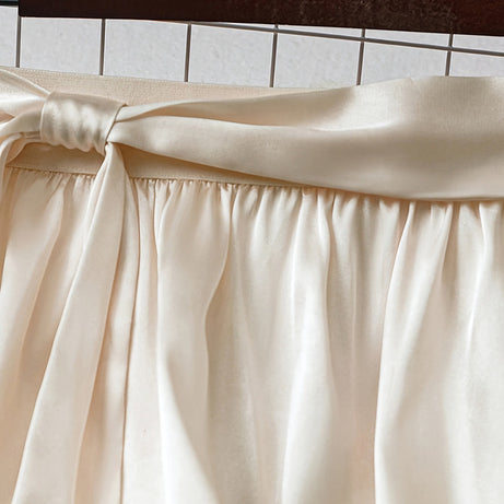 Women's Solid Color Satin Midi Skirt With Bow Detail, Elegant Pleated Skirt For Office And Vacation Wear